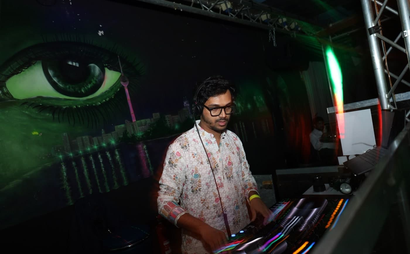 DJ performing behind the decks